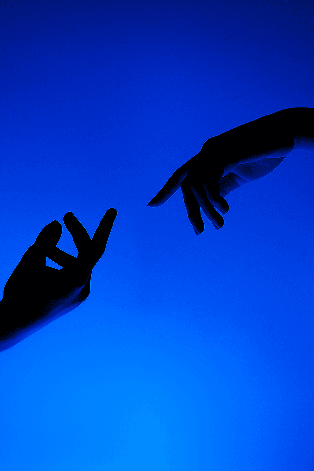 Silhouetted hands reaching toward each other in a blue light.
